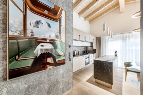 Dining area and kitchen with Miele appliances in Penthouse 2000